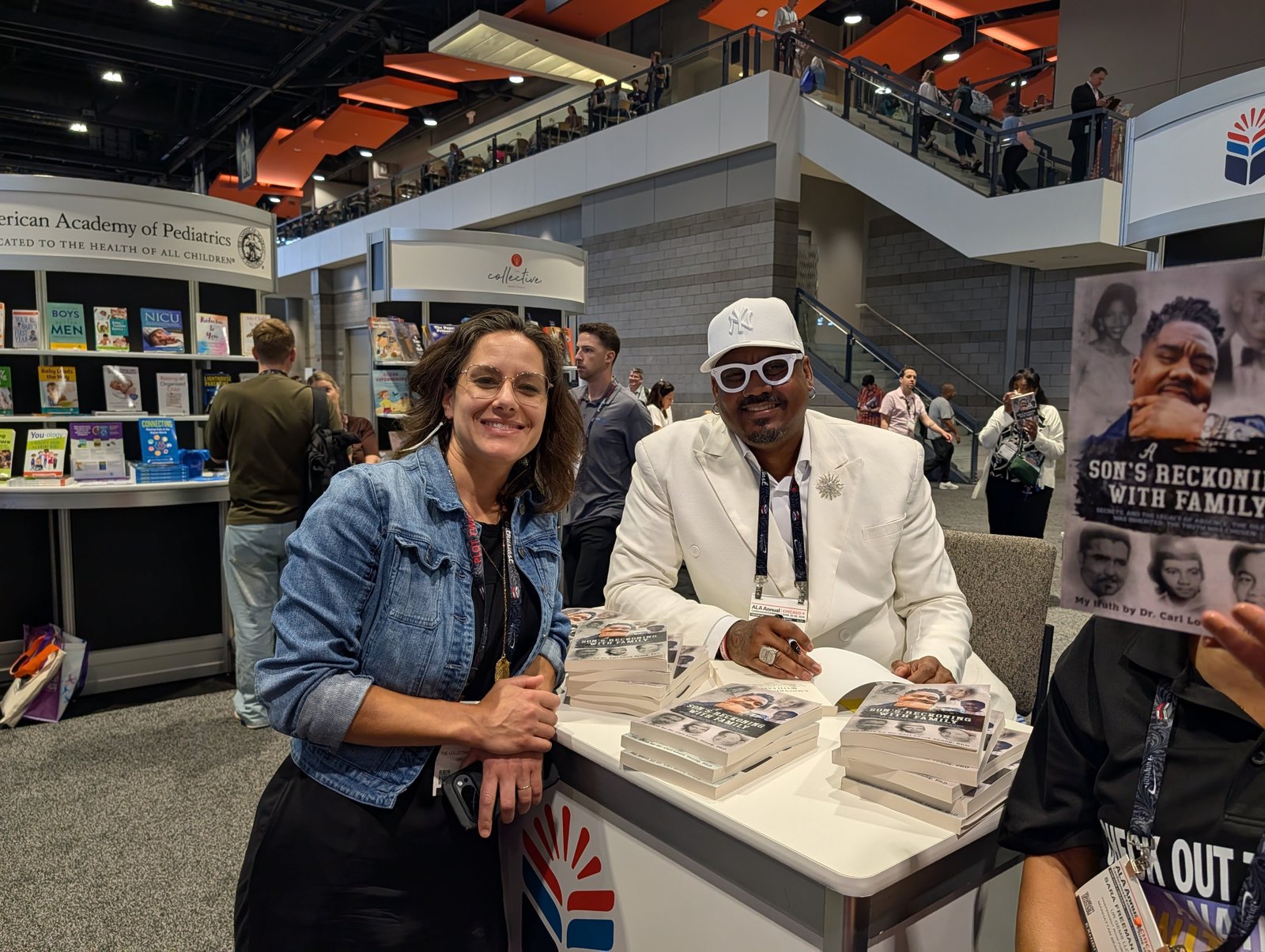 Dr. Carl L. Young signing books at the American Library Association Conference